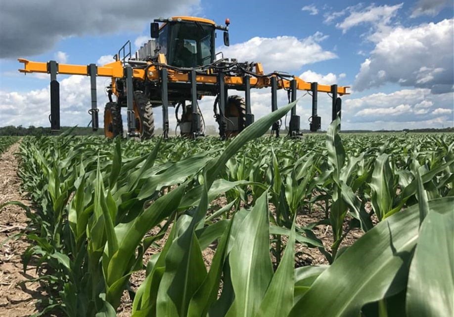 Agroliquid - large tractor over corn field